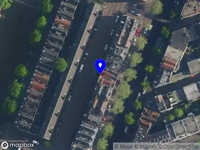 Ambulance met grote spoed naar de Westerkade in Amsterdam