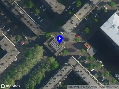 Ambulance met grote spoed naar de Wittenburgergracht in Amsterdam