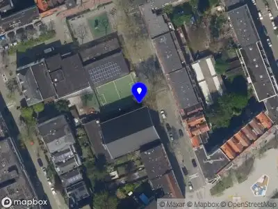 Ambulance met grote spoed naar de Coloniastraat in Rotterdam