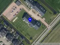 Ambulance met grote spoed naar de Hof van Leerbroek in Leerbroek