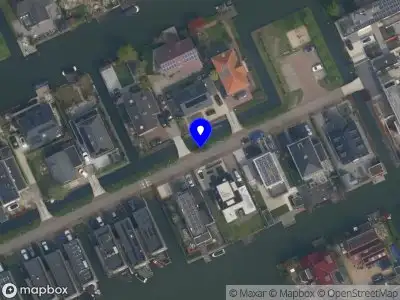 Ambulance met grote spoed naar de Jannetje Merbiskade in Rotterdam