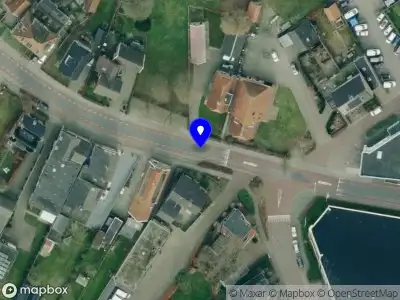 Brandweer met gepaste spoed naar de Dorpsstraat in Den Ham vanwege stormschade