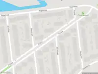 Ambulance met gepaste spoed naar de Prisma in Rhoon