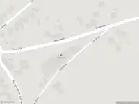 Brandweer met gepaste spoed naar de Grensweg in Budel vanwege stormschade