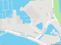 Ambulance met grote spoed naar de Buitenkerkerweg in Amsterdam