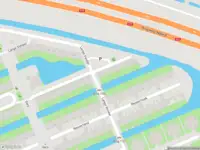 Ambulance met grote spoed naar de Buitendijk in Amsterdam