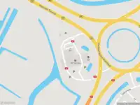 Ambulance met gepaste spoed naar de Verkeersplein Kooimeer in Alkmaar