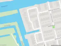 Ambulance met gepaste spoed naar de Nellie van Kolstraat in Zaandam