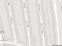 Ambulance met grote spoed naar de Reinier Claeszenstraat in Amsterdam