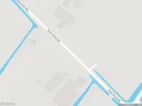 Ambulance met gepaste spoed naar de Grote Zomerdijk in Spanbroek