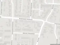 Ambulance en brandweer met gepaste spoed naar de Kerkstraat in Muntendam