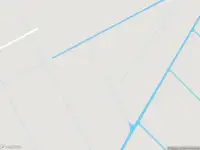 Ambulance met grote spoed naar de Spieringweg in Vijfhuizen