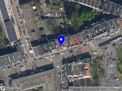 Ambulance met gepaste spoed naar de West-Kruiskade in Rotterdam