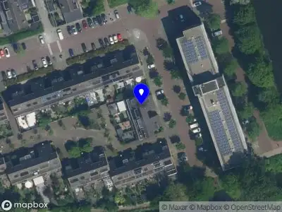 Brandweer met gepaste spoed naar de Dwarswatering in Amsterdam