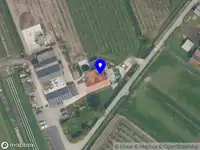 Ambulance met gepaste spoed naar de Lekdijk oost in Lopik vanwege een buitenbrand