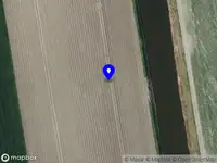 Ambulance met grote spoed naar de Westdijk in Hekelingen