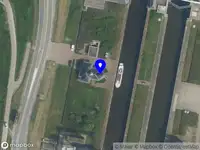 Ambulance met gepaste spoed naar de Julianasluisterrein in Gouda