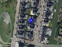 Ambulance met grote spoed naar de Bakkerspark in Rhoon vanwege gebouwbrand