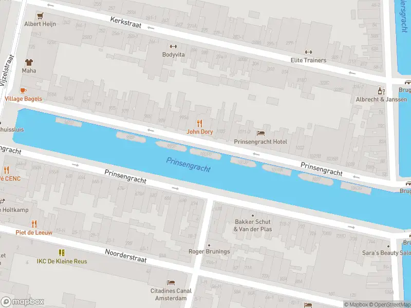 Ambulance met gepaste spoed naar de Prinsengracht in Amsterdam