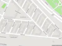 Ambulance met grote spoed naar de Damloperplein in Rotterdam