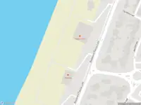 Ambulance met gepaste spoed naar de Strandafgang Paulus Loot in Zandvoort