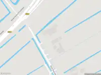 Brandweer met gepaste spoed naar de Korte Dwarsweg in Ouderkerk aan de Amstel vanwege stormschade