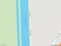 Politie naar de Driemolensweg in Lexmond vanwege personen te water