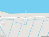 Brandweer met grote spoed naar de Dijkweg in Muiden