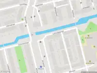 Ambulance met grote spoed naar de Lumumbasingel in Delft