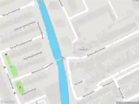 Ambulance met grote spoed naar de Vaartkade in Zaandam