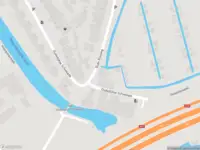Ambulance met grote spoed naar de Oude Kleiweg in Rotterdam