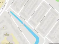 Ambulance met gepaste spoed naar de Uhlenbeckkade in Leiden