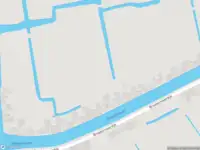 Ambulance met grote spoed naar de Broekermeerdijk in Broek in Waterland
