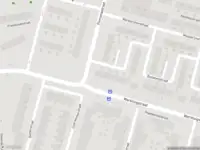 Ambulance met gepaste spoed naar de Notenstraat in Amsterdam