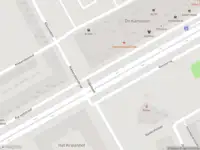 Ambulance met grote spoed naar de Karspeldreef in Amsterdam