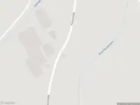 Politie naar de Putmansweg in Fleringen vanwege voertuigen te water