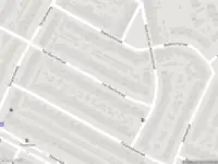 Ambulance met grote spoed naar de Van Baerlestraat in Haarlem