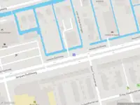 Ambulance met grote spoed naar de Jacques Dutilhweg in Rotterdam