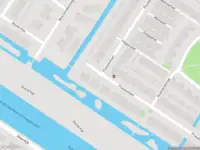 Ambulance met gepaste spoed naar de Pracanalaan in Amsterdam