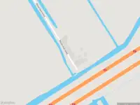 Ambulance met grote spoed naar de Westerdwarsweg in Wijdewormer