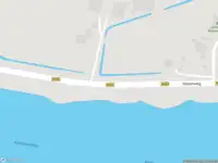 Ambulance met grote spoed naar de Havenweg in Kolhorn