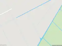 Ambulance met grote spoed naar de Spaarnwouderweg in Vijfhuizen