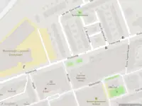 Ambulance met grote spoed naar de Ter Gouwstraat in Amsterdam