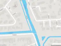 Ambulance met grote spoed naar de Trekvaart in IJsselmuiden vanwege gebouwbrand