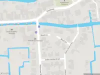 Ambulance met grote spoed naar de Woudrust in Oostwoud