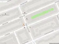 Ambulance met grote spoed naar de Okeghemstraat in Amsterdam