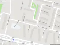 Ambulance met grote spoed naar de Burgemeester Fockstraat in Amsterdam