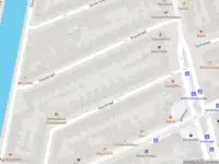 Ambulance met grote spoed naar de Schinkelkade in Amsterdam