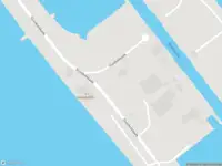 Brandweer met gepaste spoed naar de Sluiskolkkade in Den Oever