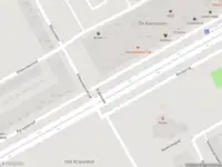 Ambulance met grote spoed naar de Karspeldreef in Amsterdam